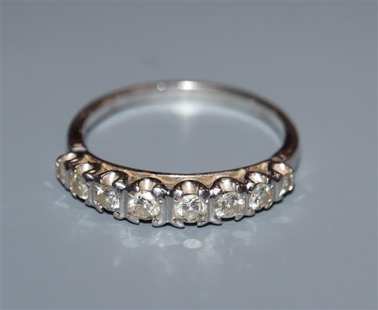 An 18ct white gold and diamond eight-stone half-hoop ring, size S.